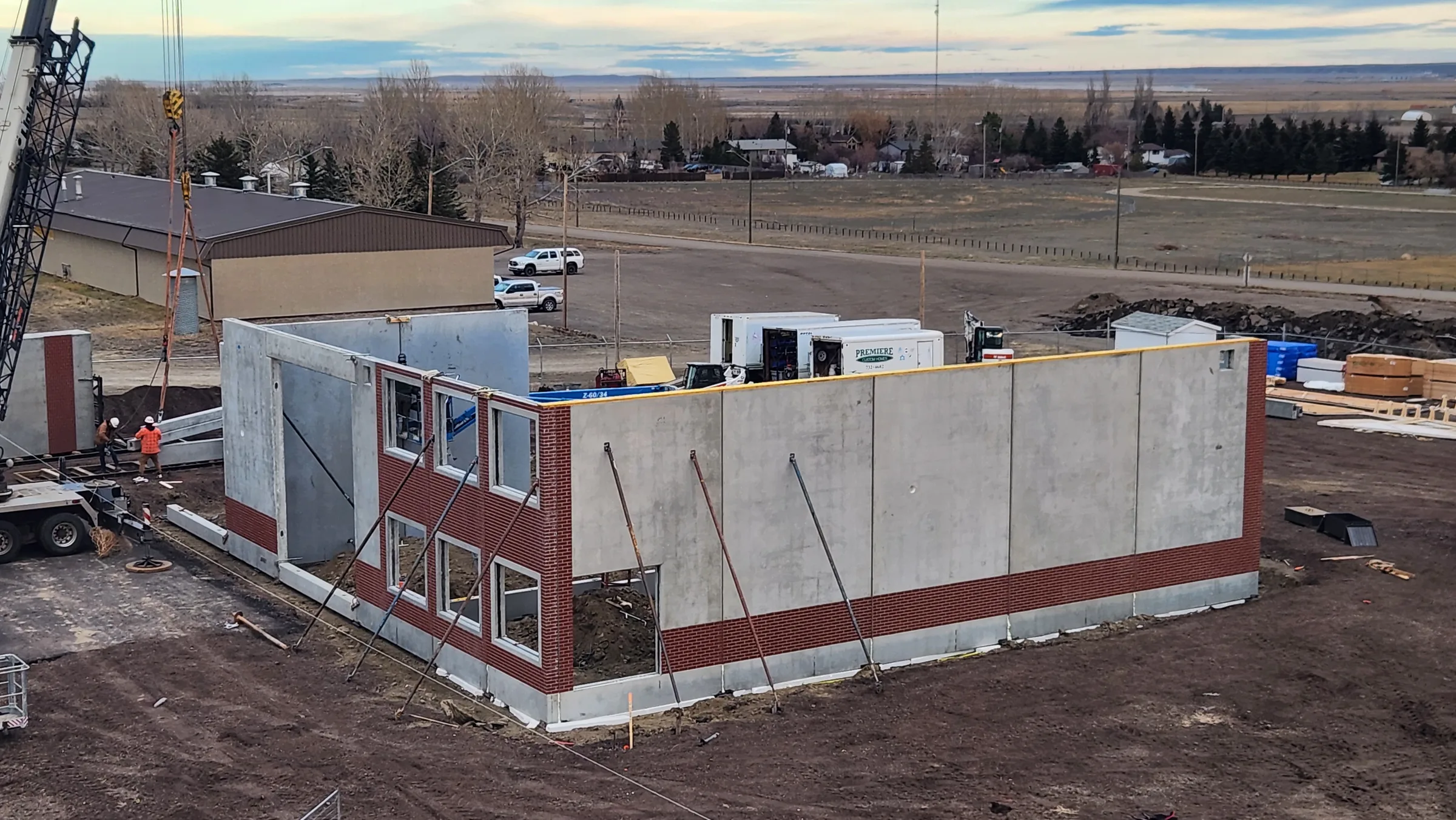 Elevated view of precast concrete and brick-faced wall panels erected for the fire hall at Seven Persons Fire Hall, built by Premiere Builders